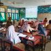 Penyampaian perkembangan dan rencana tindak lanjut pengembangan sekolah di SDN 006 Suka Makmur di Kabupaten Kampar.